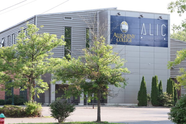 Exterior of building that houses the Allegheny Lab for Innovation and Creativity at Bessemer Street location with trees in foreground