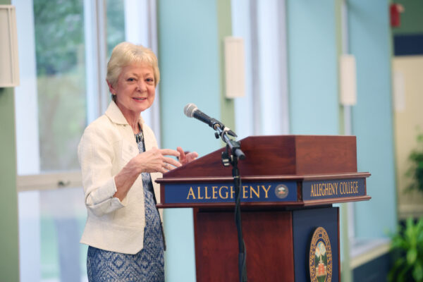 Kim Tillotson Fleming speaking at a podium