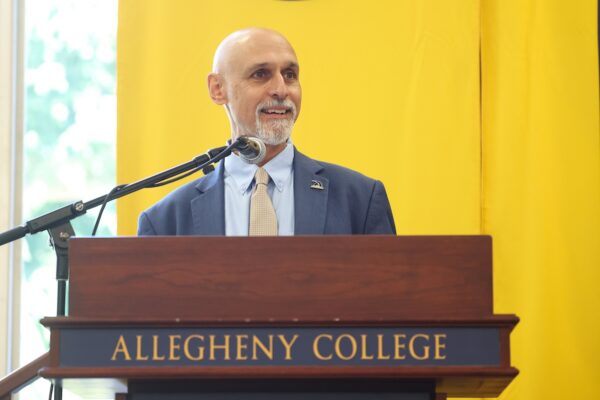 Allegheny College President Ron Cole '87 speaks at a podium