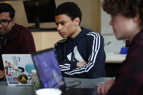 a student looking at a laptop