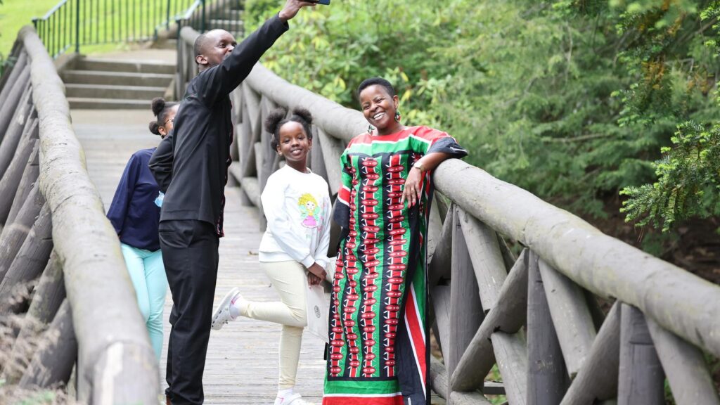 a family posing for a picture on a bridge