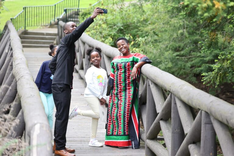 a family posing for a picture on a bridge