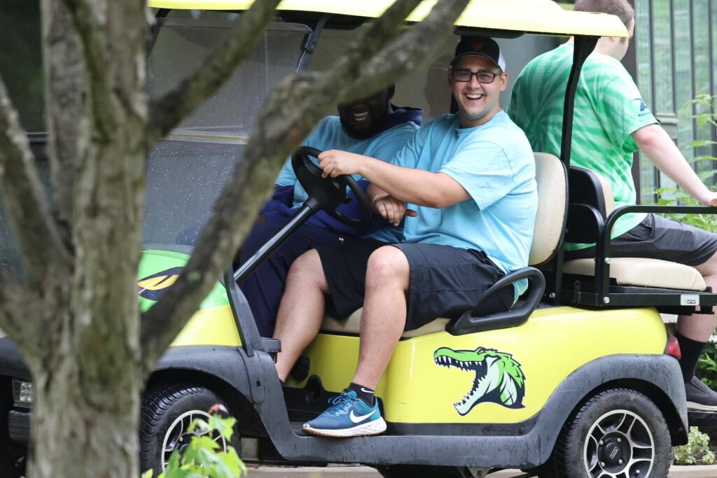 people riding in a golf cart