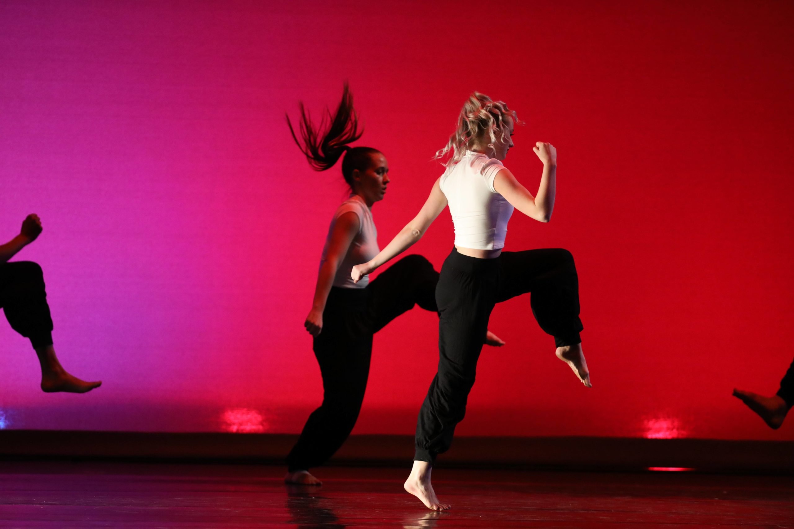 Two students dancing on stage