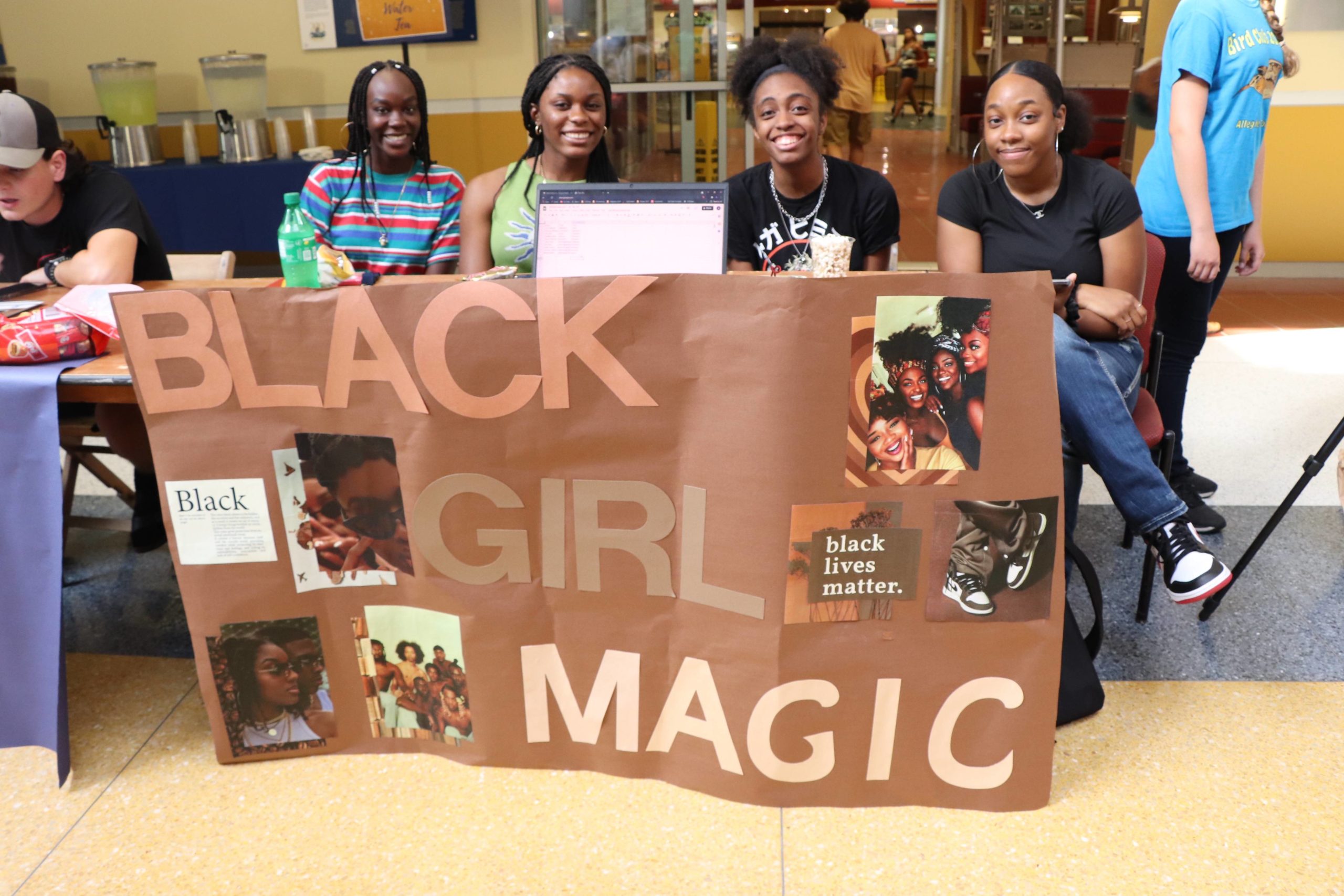 Members of the club Black Girl Magic posing at a club showcase