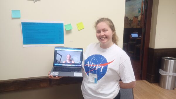a person holding a laptop