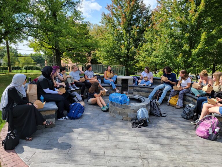 group of students sitting outside