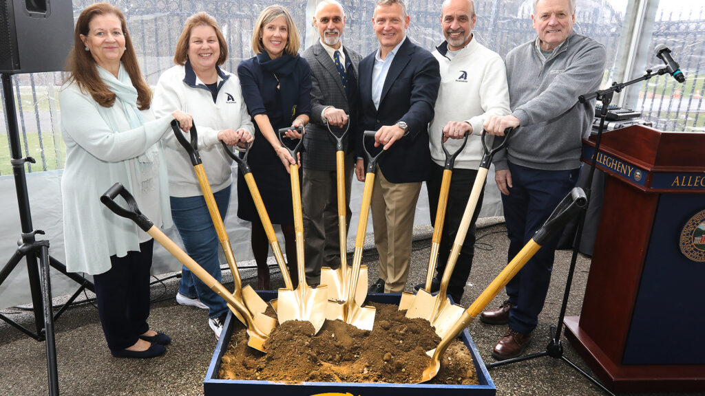 Trustees shoveling dirt for a groundbreaking