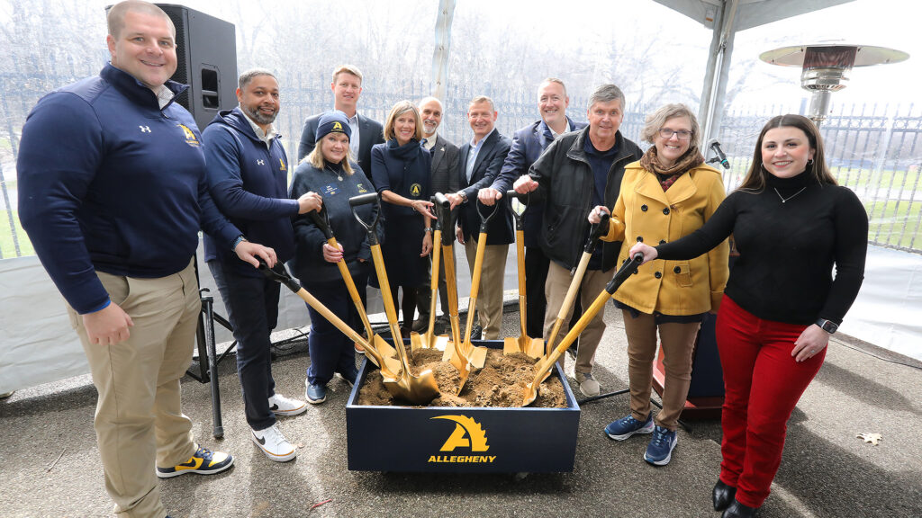 Institutional Advacement team shoveling dirt for a groundbreaking