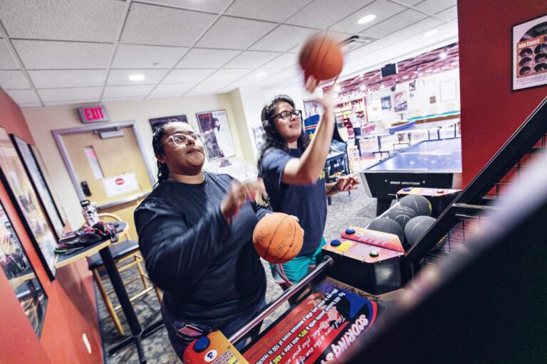 Students playing in the game room