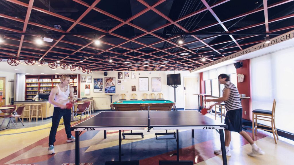 Students playing in the game room