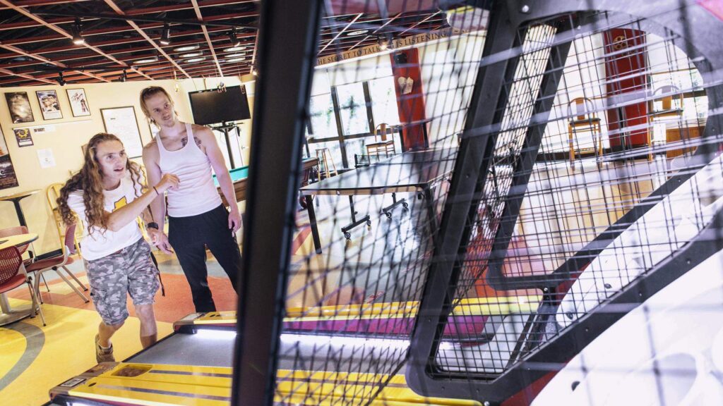 Students playing in the game room