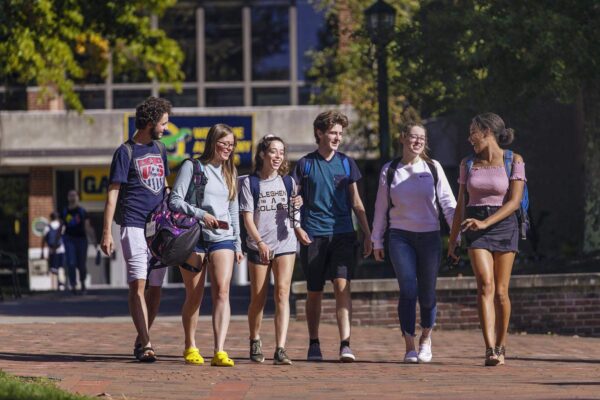 group of students walking along path