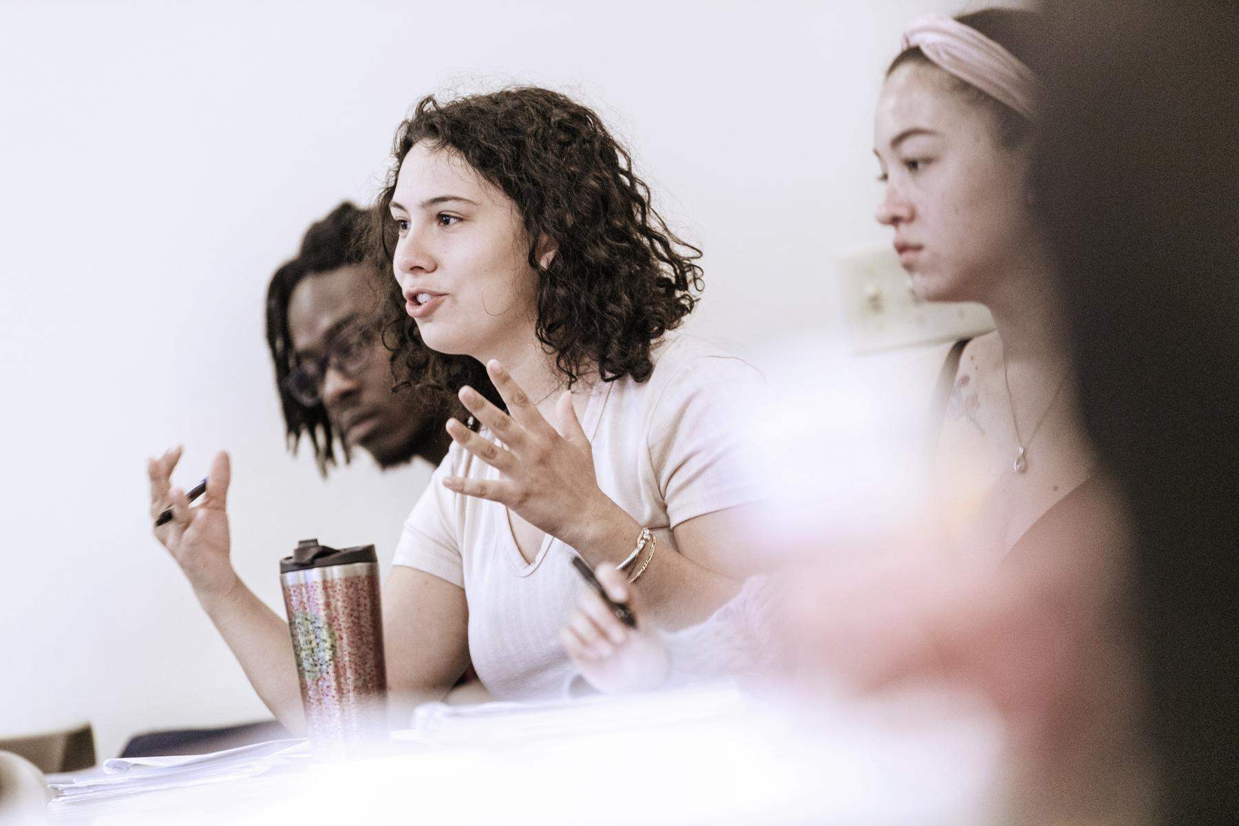 a group of students sitting at a table