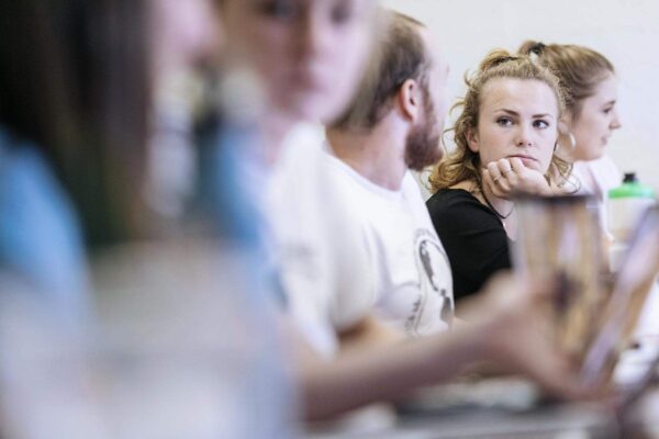 a group of students sitting in a classroom