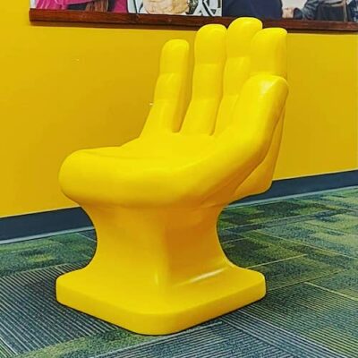a yellow chair in a room