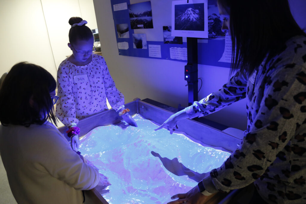 a group of students in a dark room