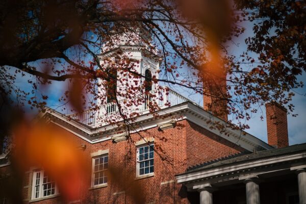 The top of Bentley Hall at Allegheny College surrounded by fall foliage