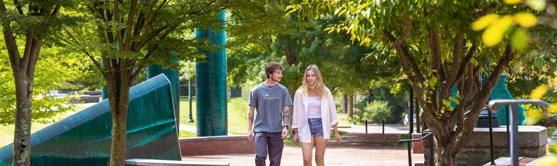 Two Allegheny College students walk down the Senior Circle