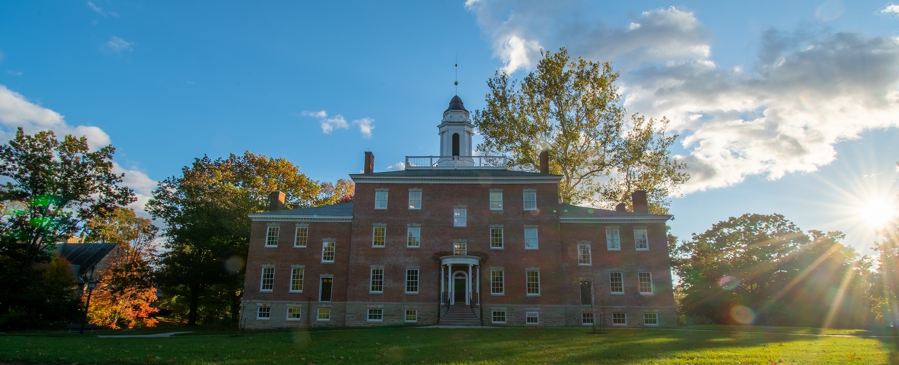 Bentley Hall at Allegheny College with the sun shining behind it