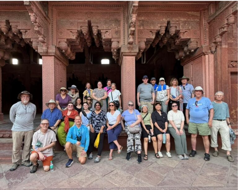 Allegheny College 2026 Alumni Tour group standing at the portals of history in the UNESCO World Heritage site of Agra Fort
