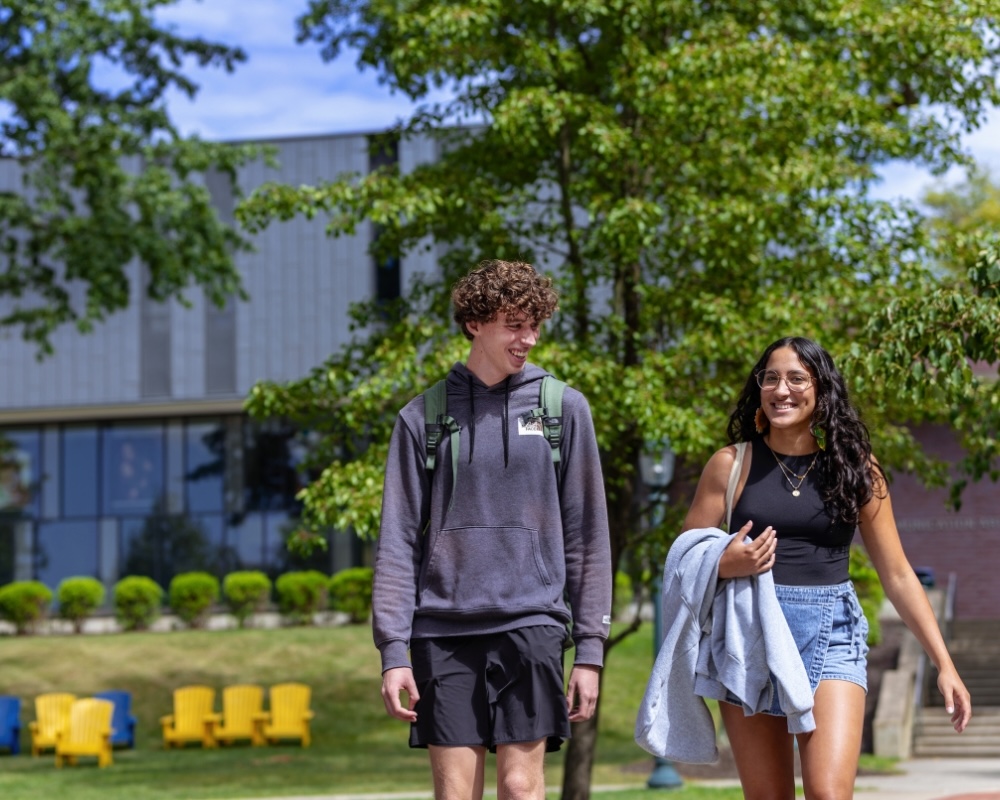 Two Allegheny College students walk across campus