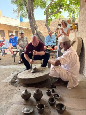A man practices uses a pottery wheel in Bishnoi Village, Jodhpur.