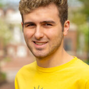 Man in yellow Allegheny College shirt