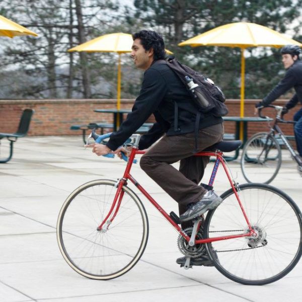 Student riding a bike.