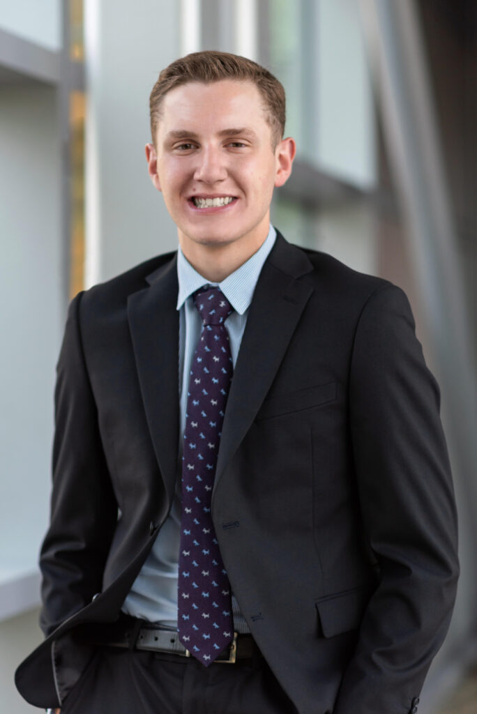 a young man in a suit and tie