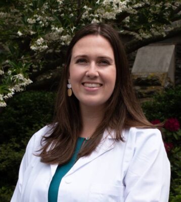 portrait of a person in a white coat