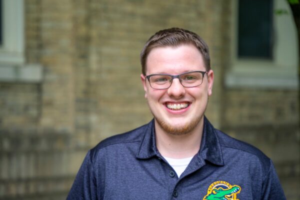 portrait of a person wearing glasses smiling