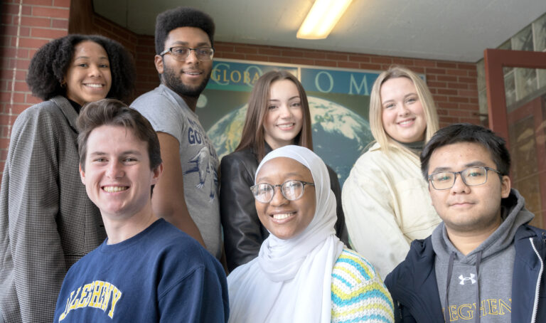 group of seven students posing for photo