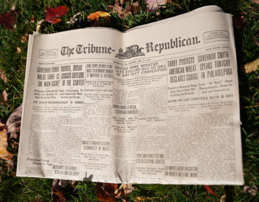 a newspaper on the grass