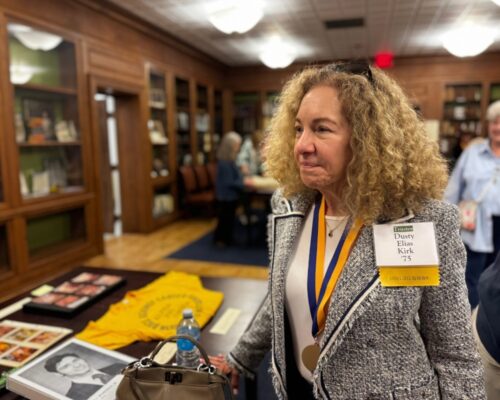 Alumna and trustee Dusty Elias Kirk peruses Allegheny College's Merrick Archives during the 2025 Reunion Weekend.