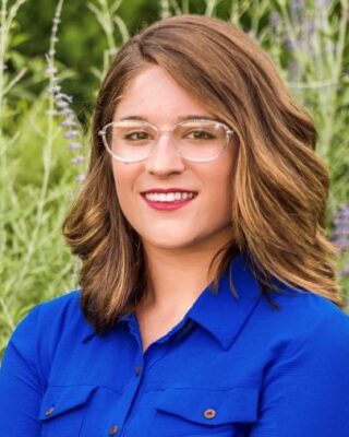 portrait of a person in a blue shirt