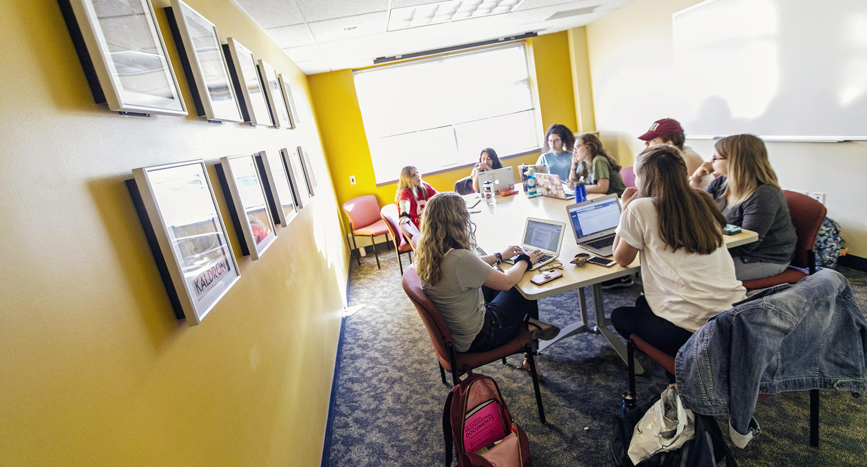 a group of students sitting around a table