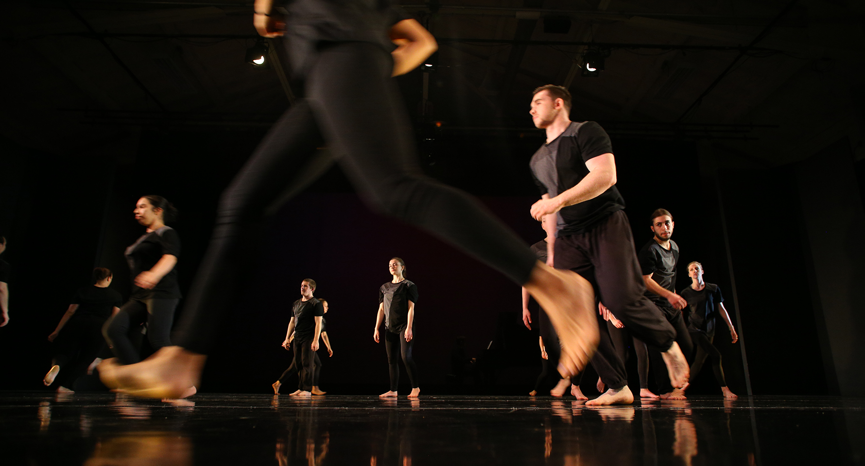 a group of students performing on a stage