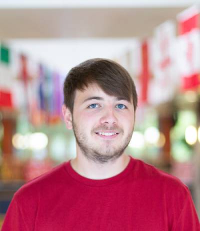 portrait of a person in a red shirt