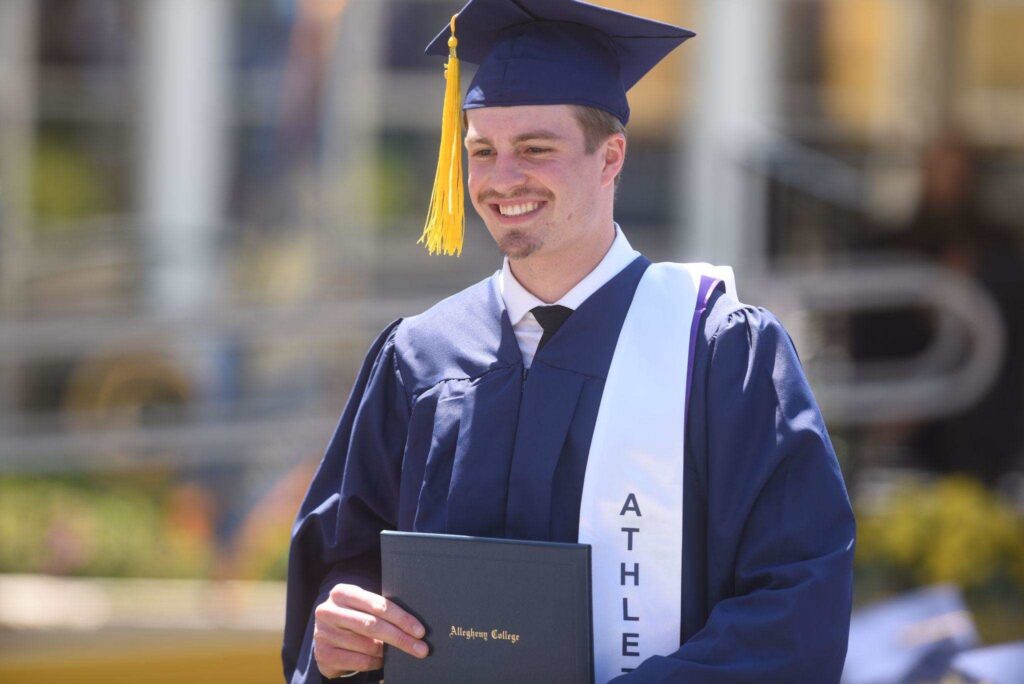 Student wearing graduation robes.