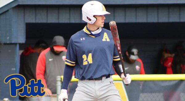 a student athlete holding a baseball bat