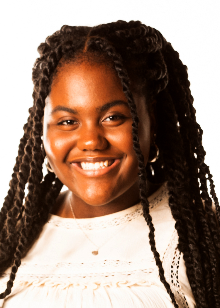 Smiling woman with long black hair and white shirt