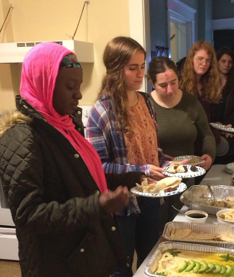 Students holding plates of food