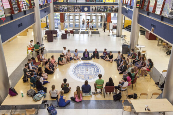 Students Meditating on Campus Center Floor