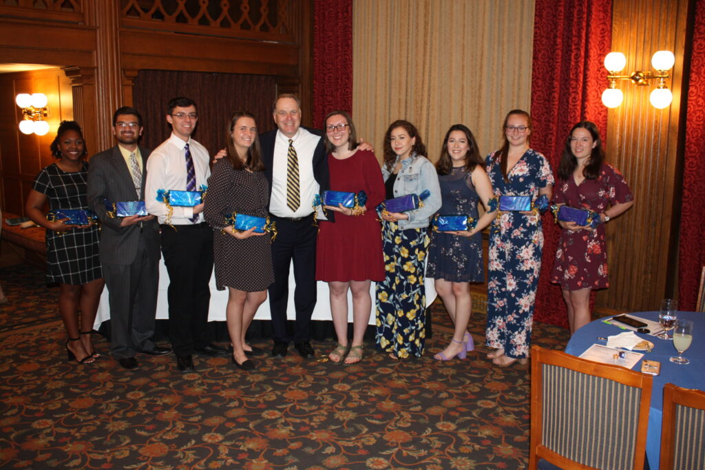 a group of people holding an award