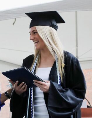 a person in a graduation cap and gown