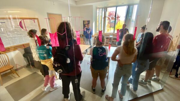 a group of students standing in a room