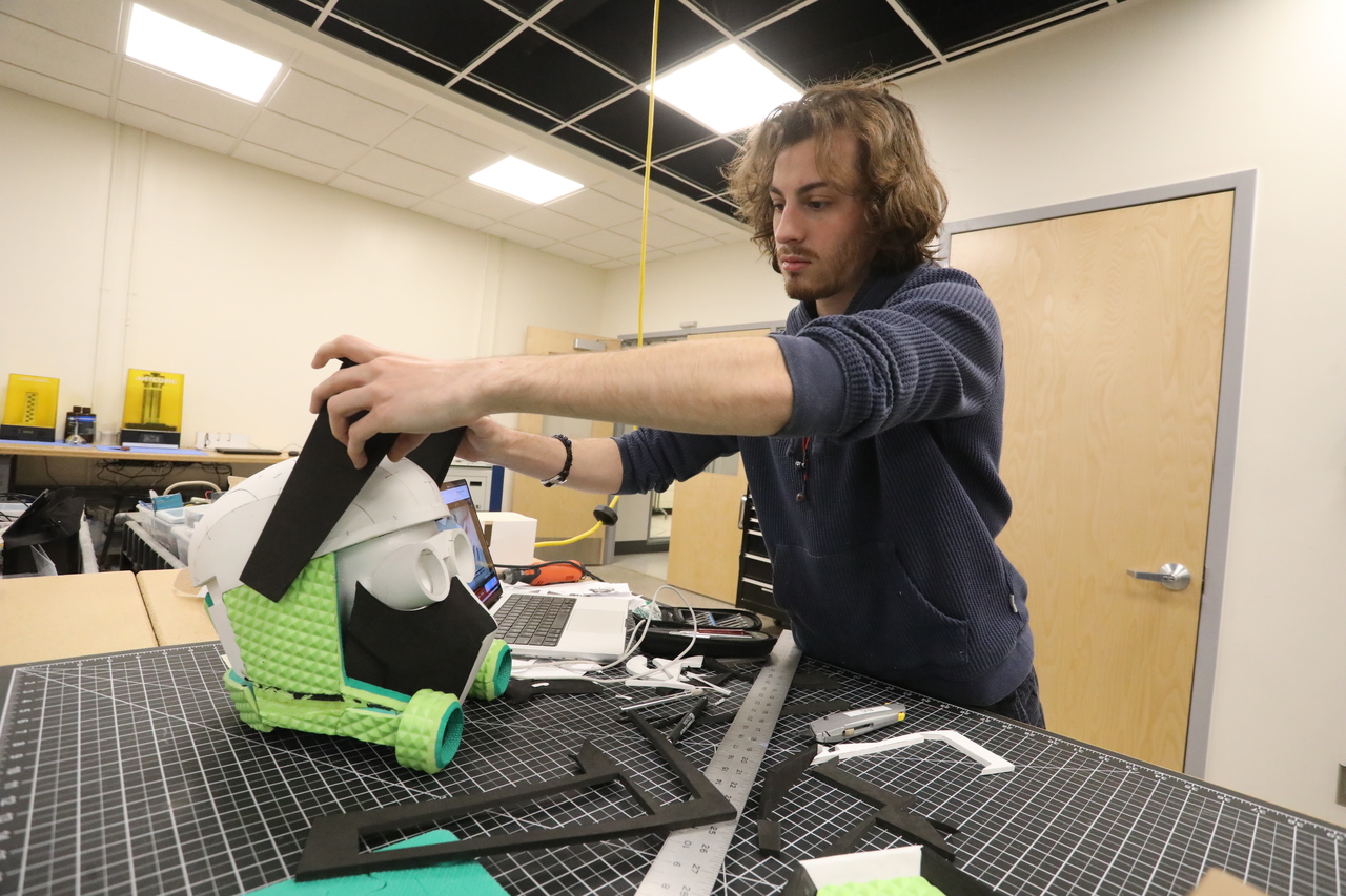 a student working on a homemade mask