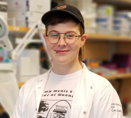 portrait of a person wearing a hat and glasses