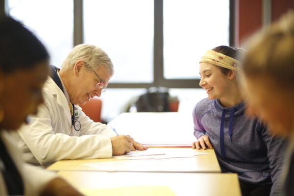 advisor and student sitting across a table from each other